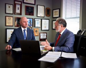 Lawyers at Shane Phelps Law discussing a case